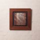Semi abstract artwork of light through trees out of veneer and acrylic in wooden frame