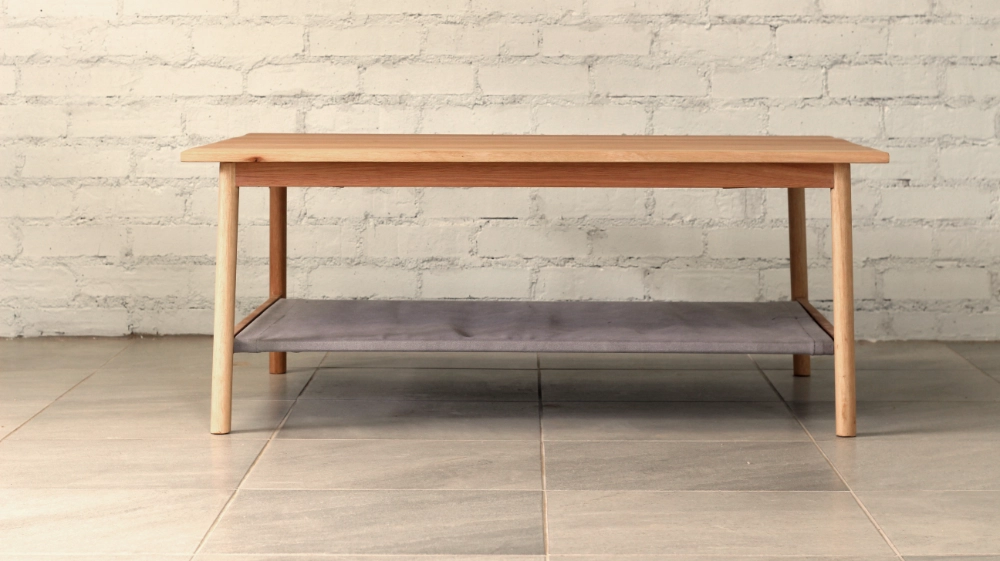 Eucalyptus grandis coffee table round section legs fabric shelf