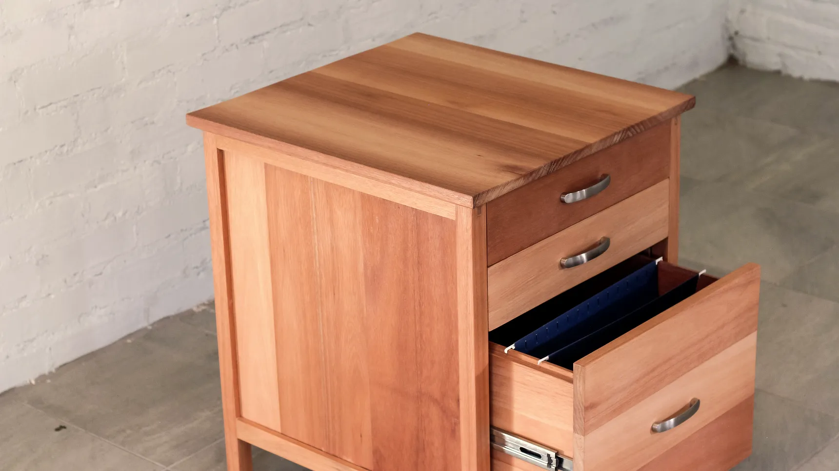 Detail of set of drawers with suspension file bottom drawer open.