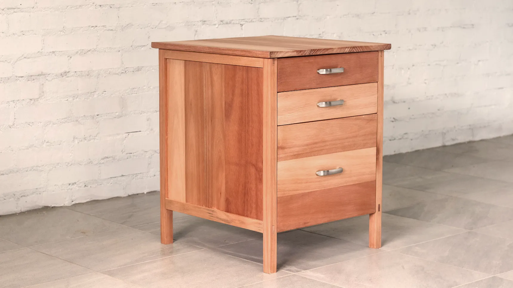 Set of drawers made from pale, warm brown timber.