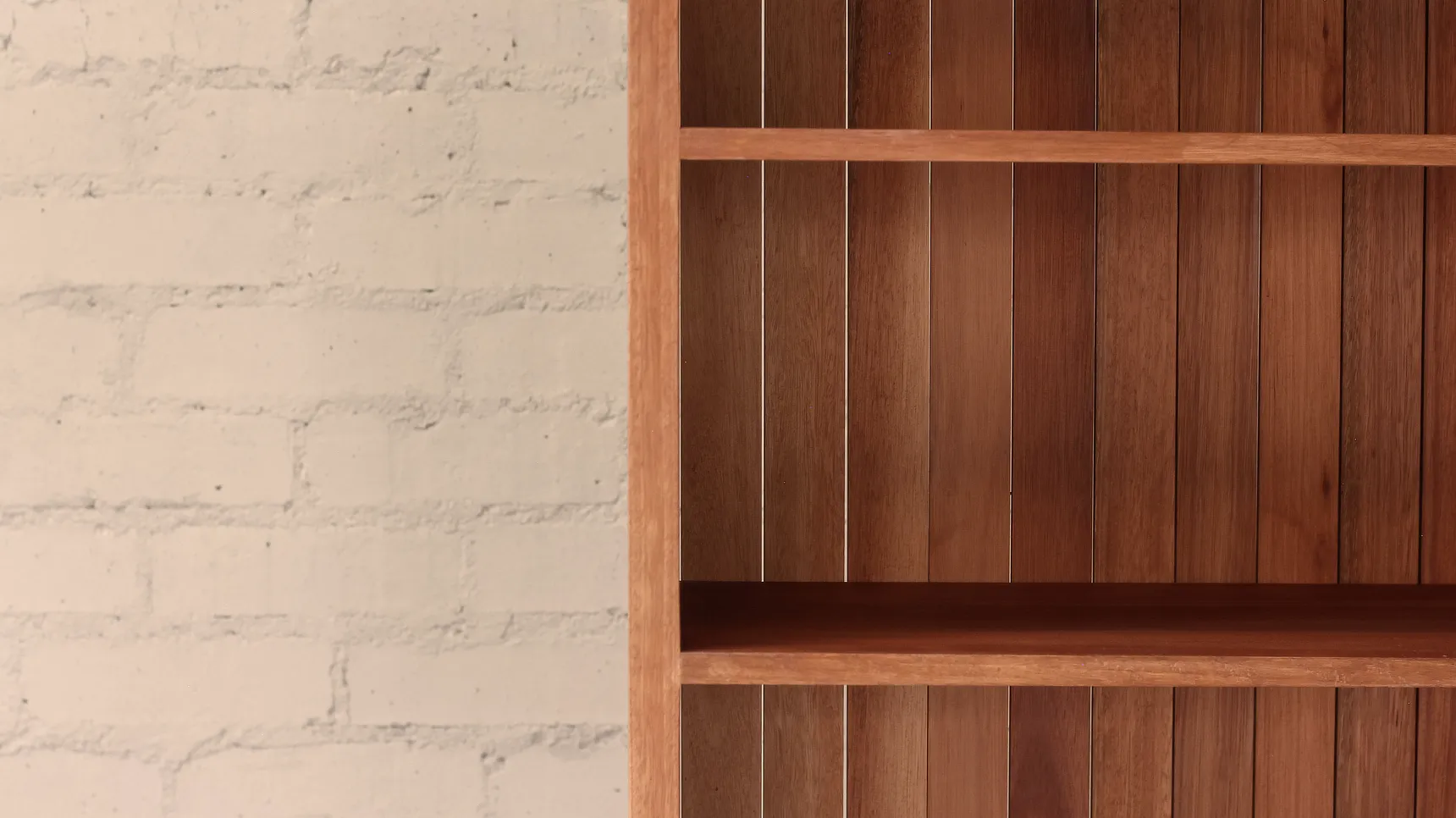Shelving Detail Front Detail of bookcase made from deep brown timber showing shelves and slatted hardwood back panel.