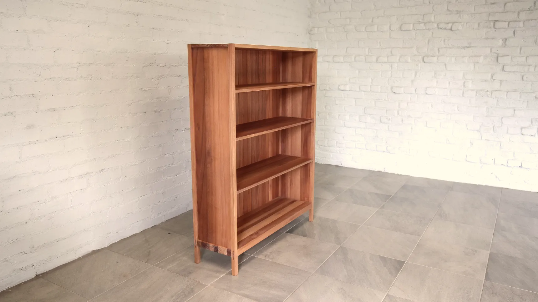 Shelving Three Quater Bookcase made from deep brown timber showing shelves and slatted hardwood back panel.