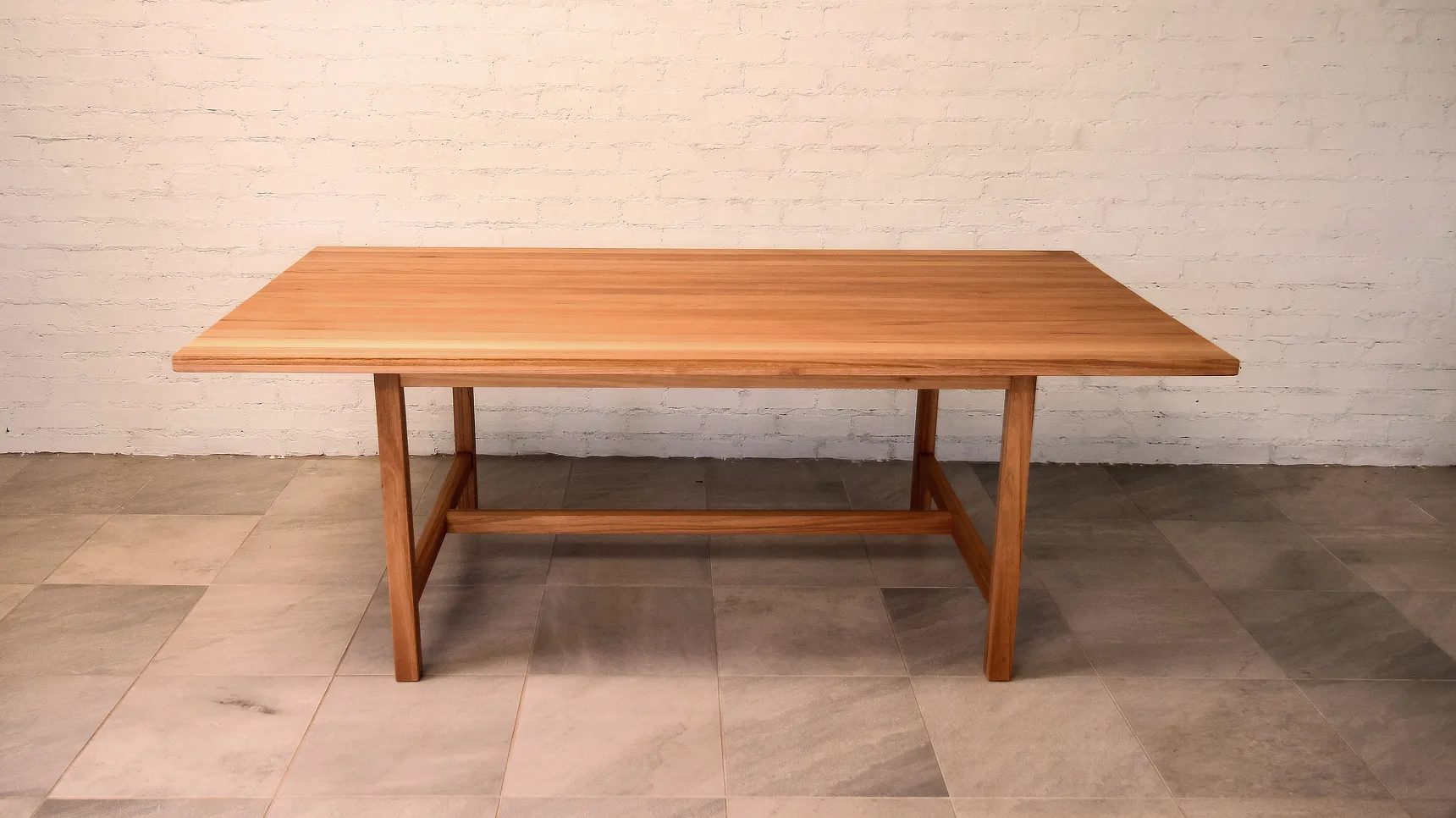 Linear table made from a pale timber.