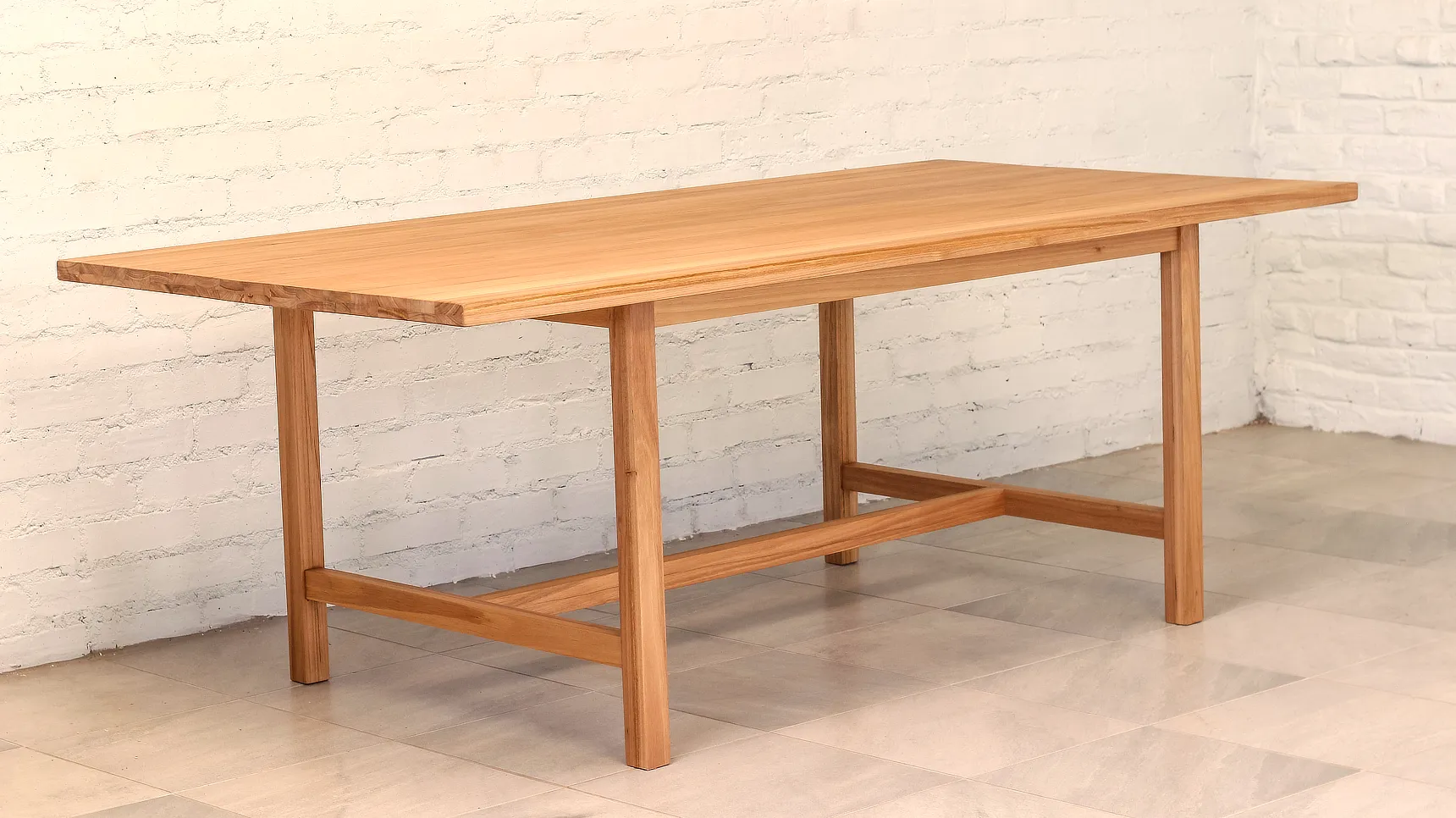 Linear table made from a pale timber.