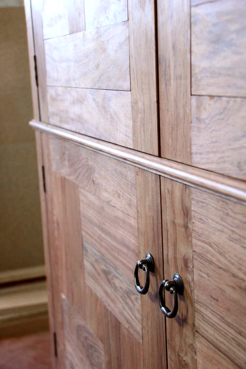 A detail shot of a teak wardrobe.